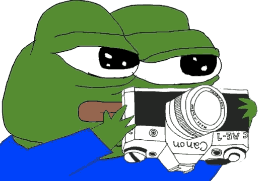 Pepe holding a Canon AE-1 film camera upside-down.